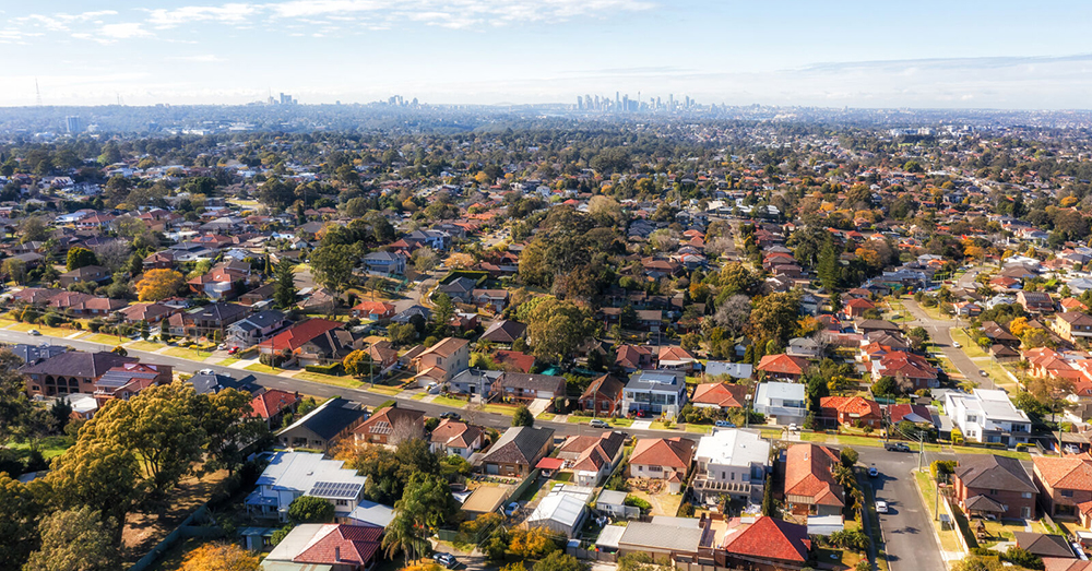 A drone shot of Sydney suburban houses..