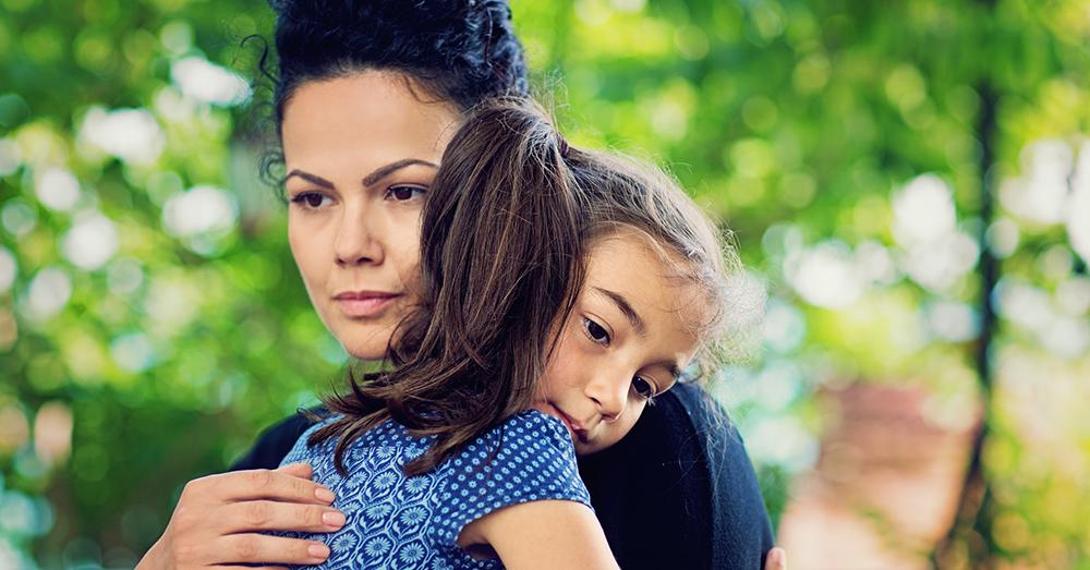 Mother is holding her beloved daughter.
