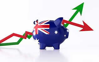 Piggy bank with Australian flag painted on it and graph arrows placed behind it.