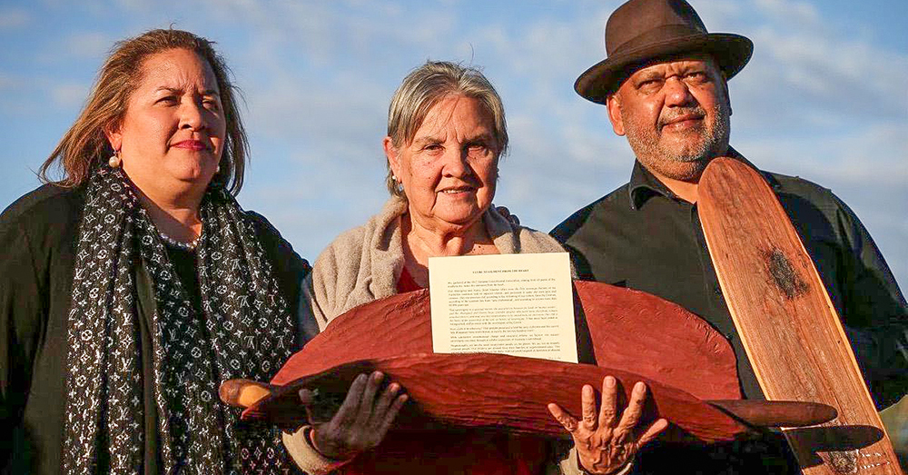 Three Aboriginal Elders with the Statement from The Heart at Uluru.