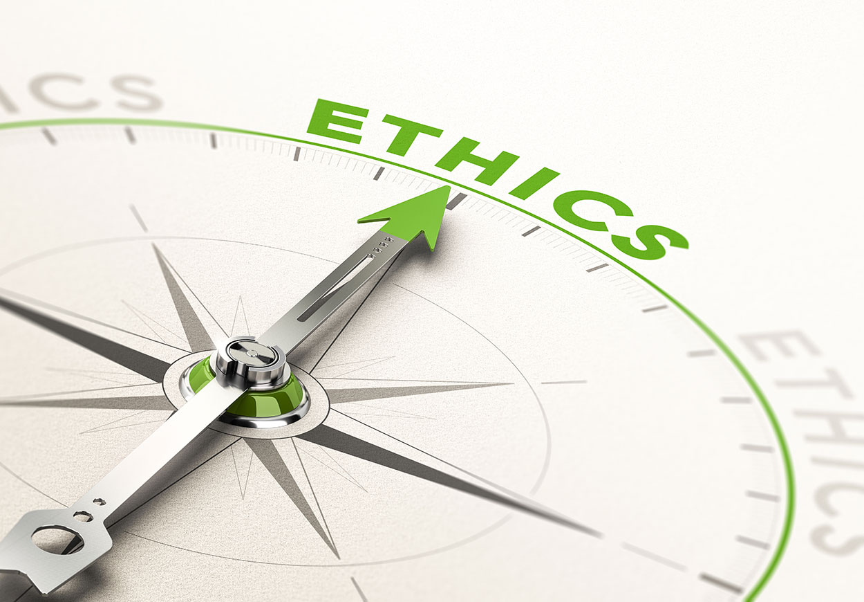 A compass, with the needle pointing to the word "ethics".