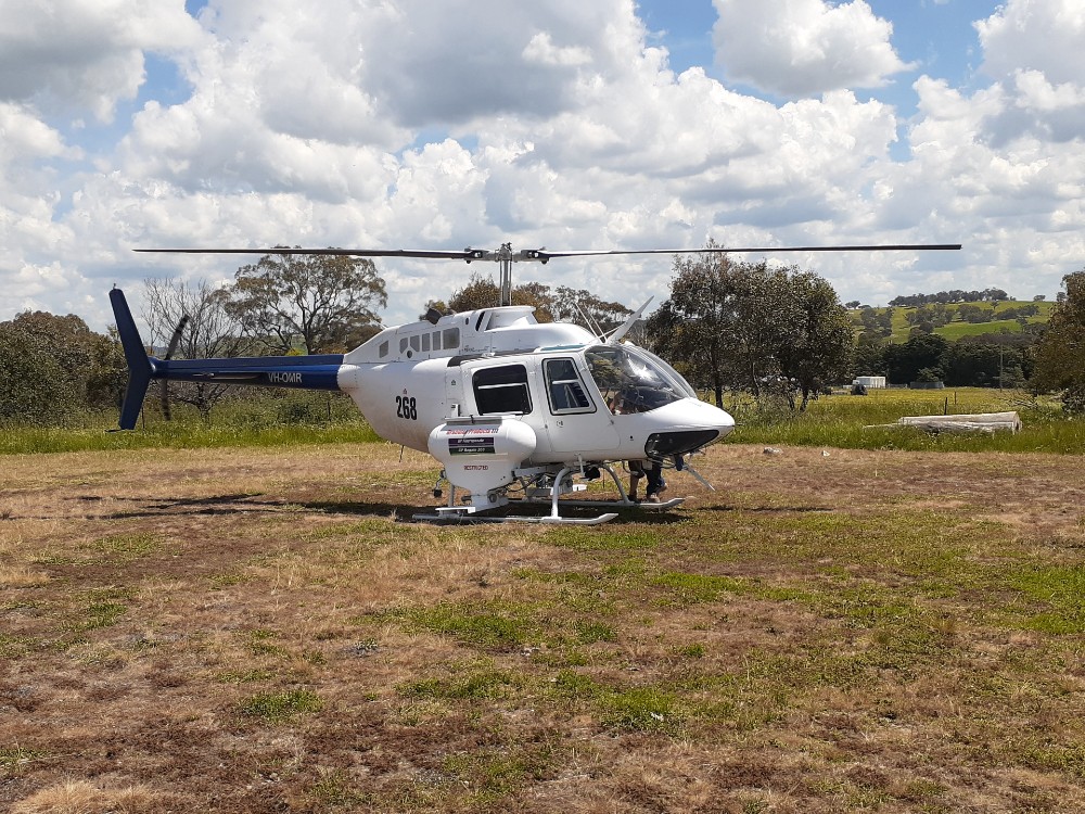 landed helicopter that conducts aerial spraying