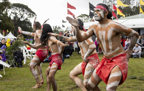 Aboriginal men perform a welcome dance. 